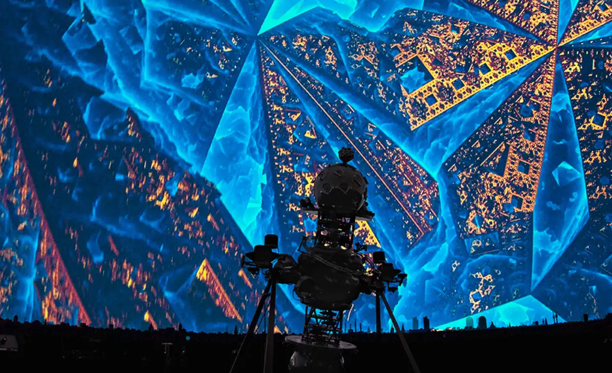 Ein großer Bildschirm mit einem blauen und gelben Hintergrund, der eine lebendige und ansprechende visuelle Darstellung bietet.