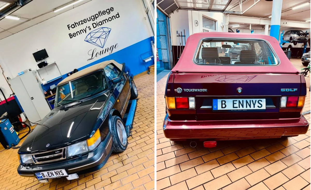 Zwei Fahrzeuge in der Fahrzeugpflege Benny´s Diamond Lounge in Berlin, links ein schwarzer Oldtimer mit glänzendem Lack vor einer Wand mit Logo, rechts die Heckansicht eines roten Volkswagen Golf mit individuellem Kennzeichen 'B ENNYS'.